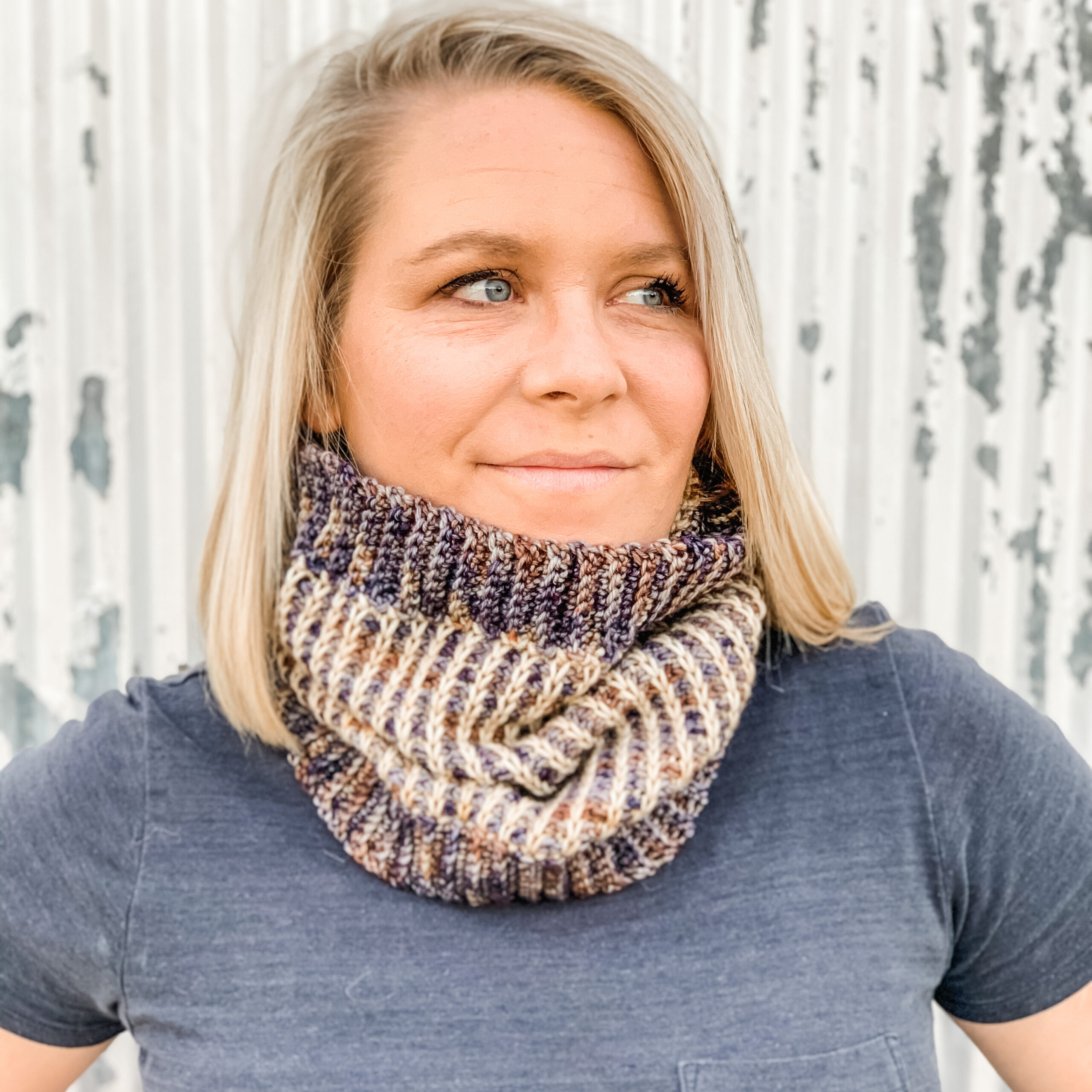 Woman wearing two color tunisian ribbed cowl