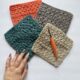 A set of four crochet squares on a white background with a peach crochet hook